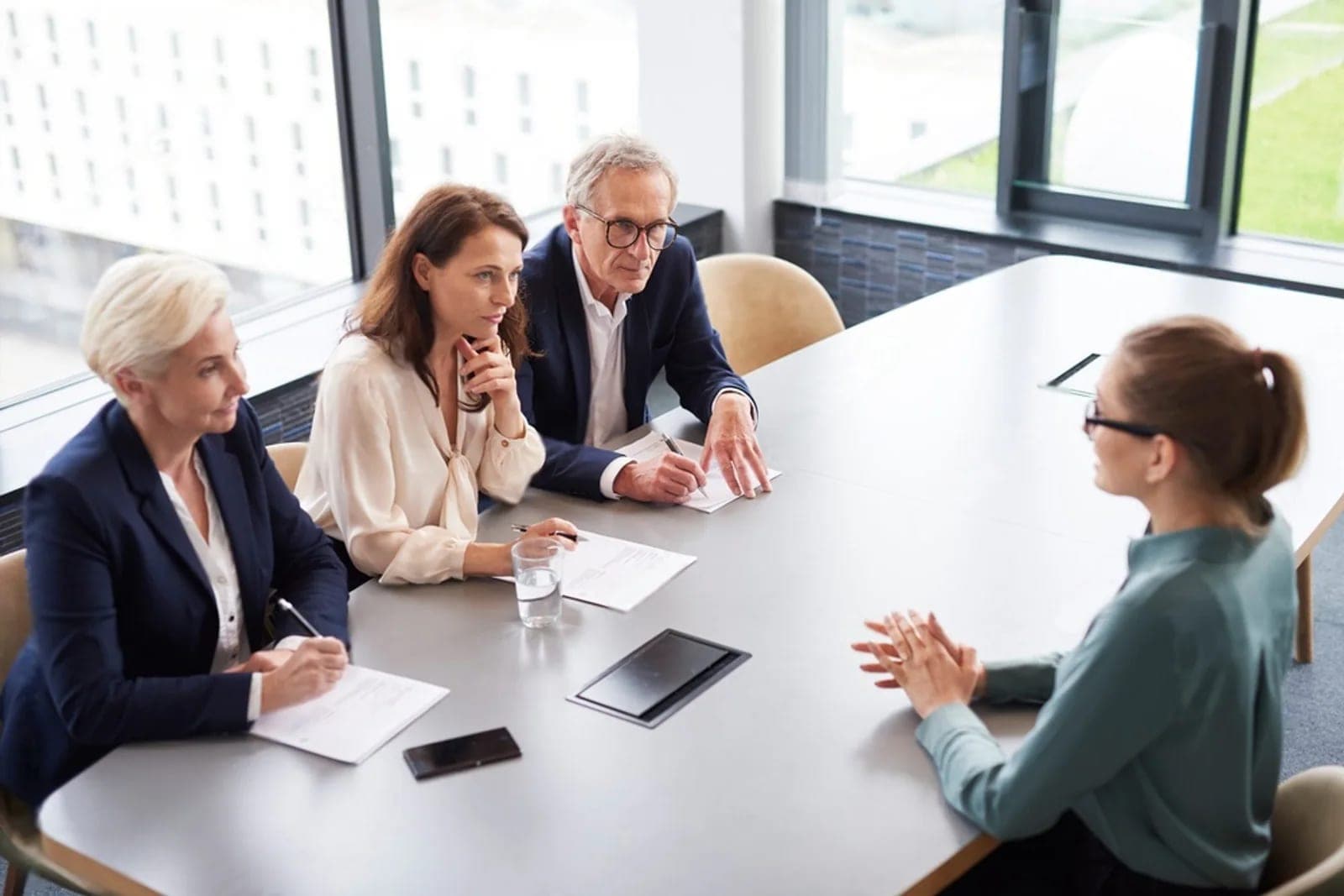 Experienced colleagues helping one another during a discussion