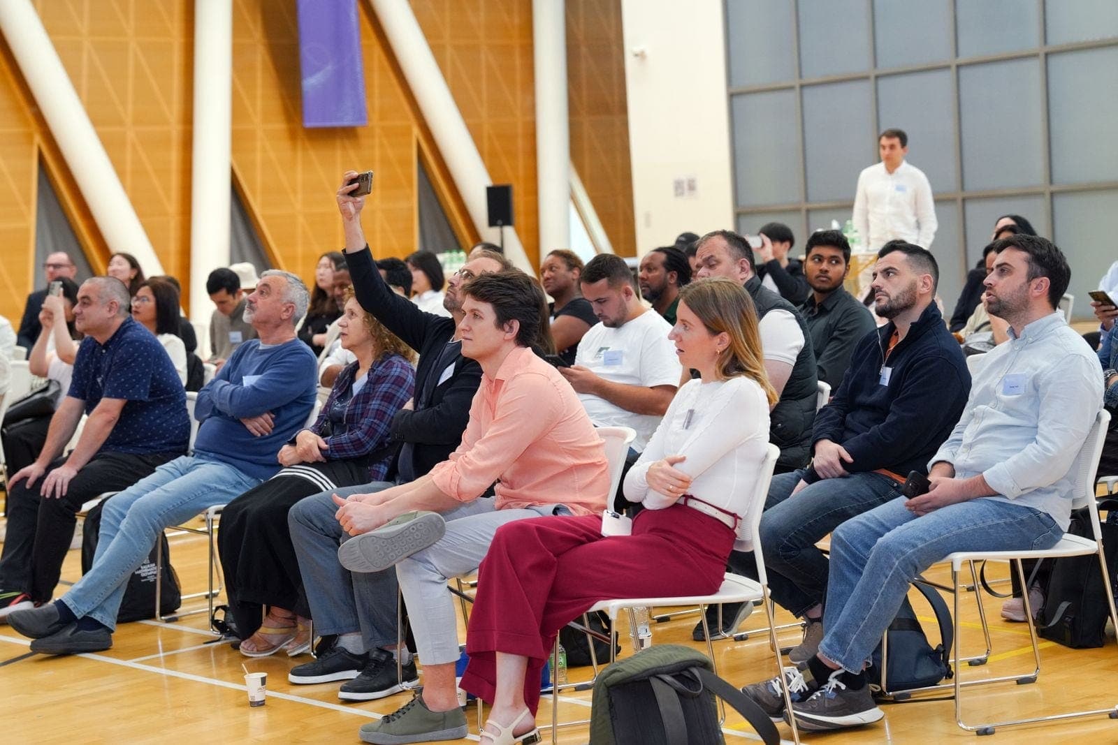 Diverse Audience Engaged at Indoor Seminar