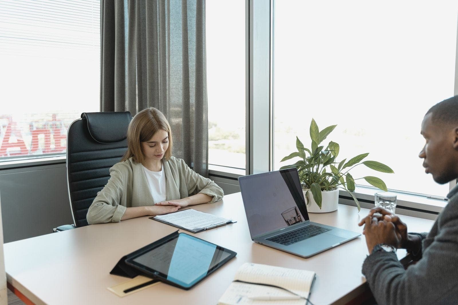 A Man Interviewing an Applicant