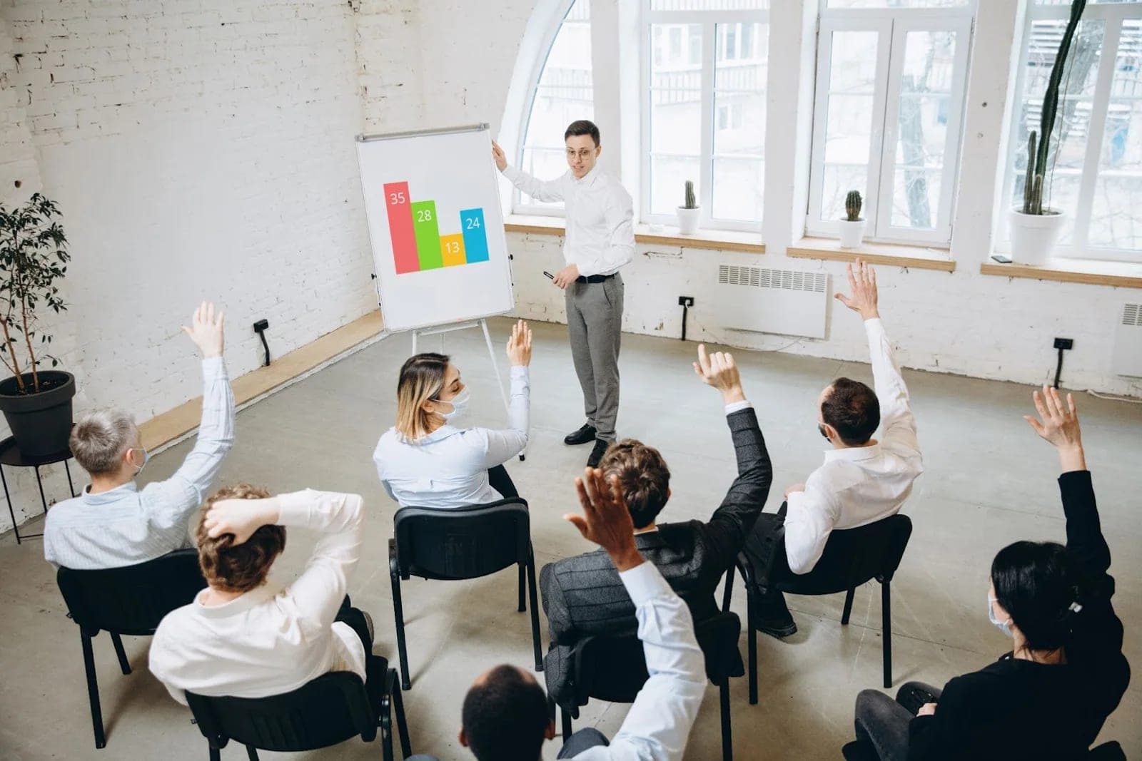 A communication instructor guiding an attentive group