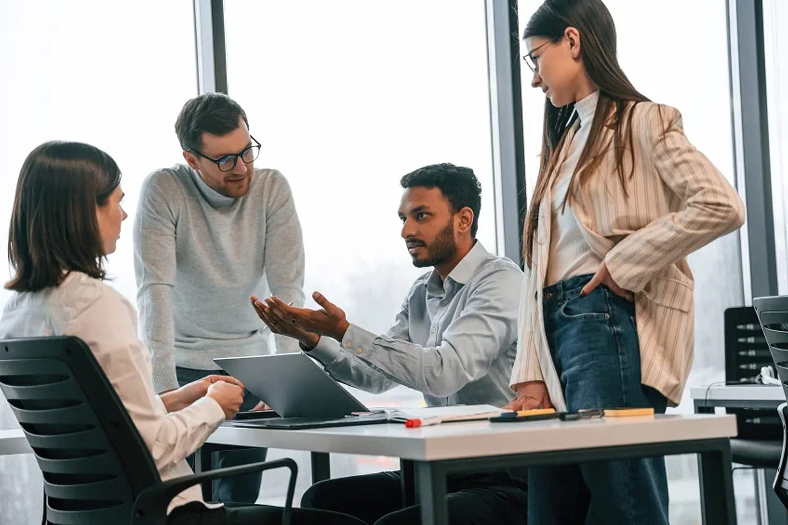 Professionals discussing clear communication in a practical workshop