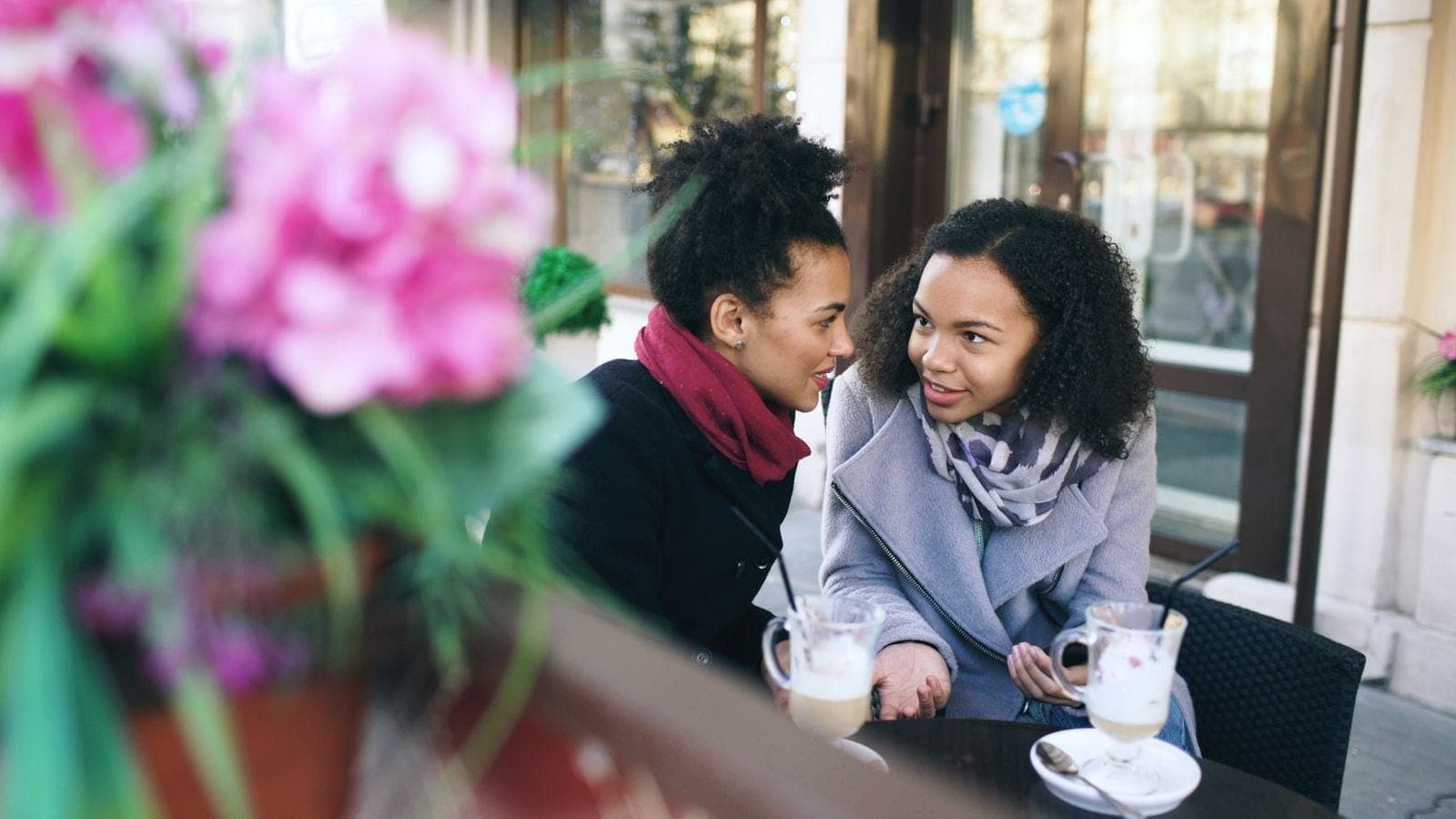 Casual Conversation Between Two Friends at a Cafe