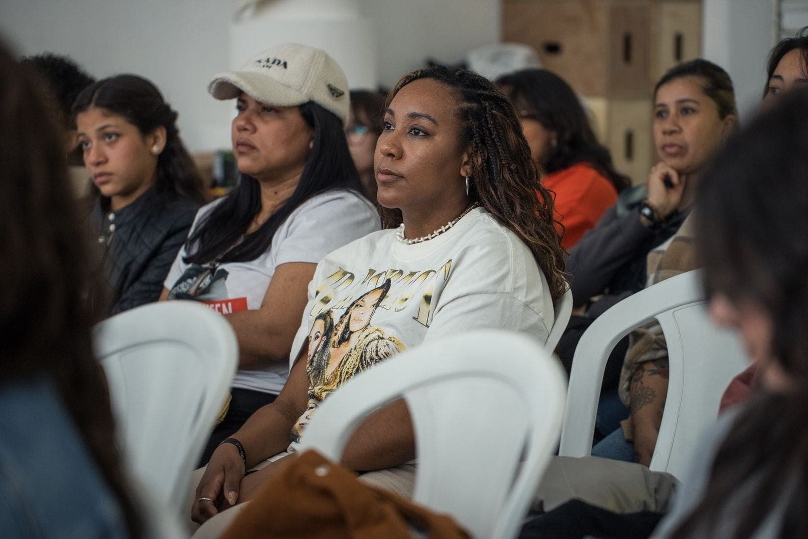 Diverse Audience Engaged in Indoor Workshop
