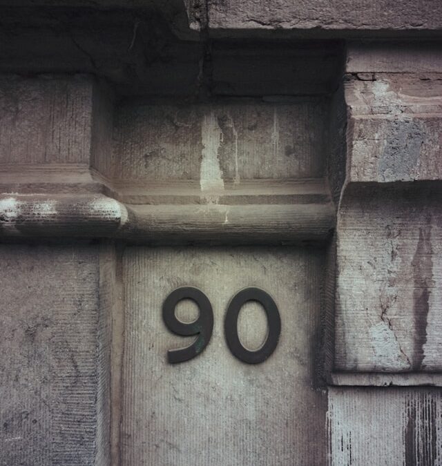 Image of a side of the building with the number 90 on it.