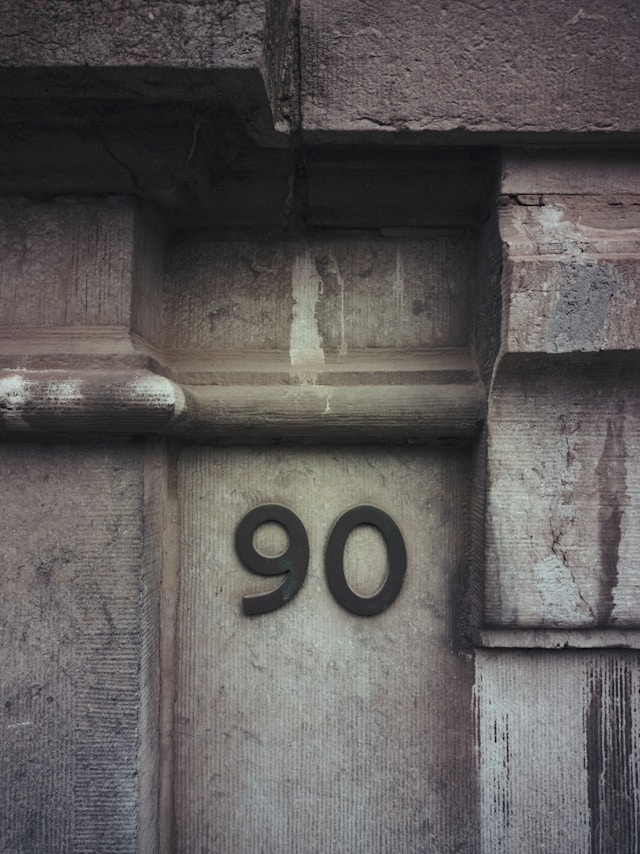 Image of a side of the building with the number 90 on it.